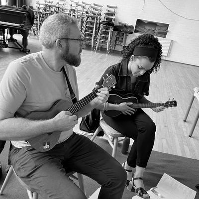 Two players working through a song together at rehearsal.