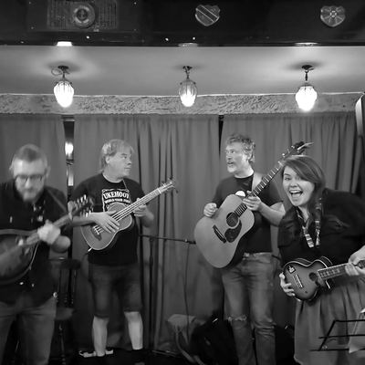 The band on the Bowlers Rest stage, mandolin and ukuleles going.