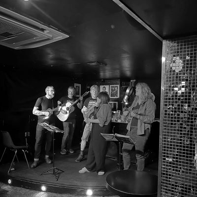The band on the small stage at Fingers Piano Bar.