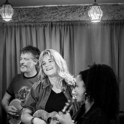 A player laughing with the fiddler alongside.