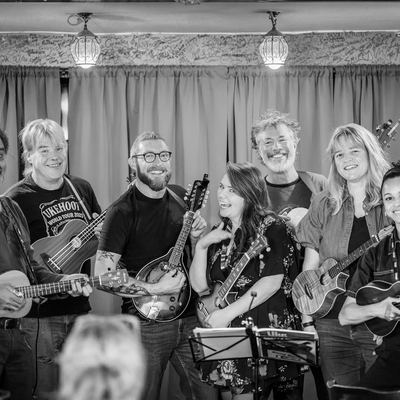The whole band grinning across the Bowlers Rest stage.