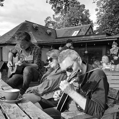 An outdoor rehearsal round a picnic table in September.